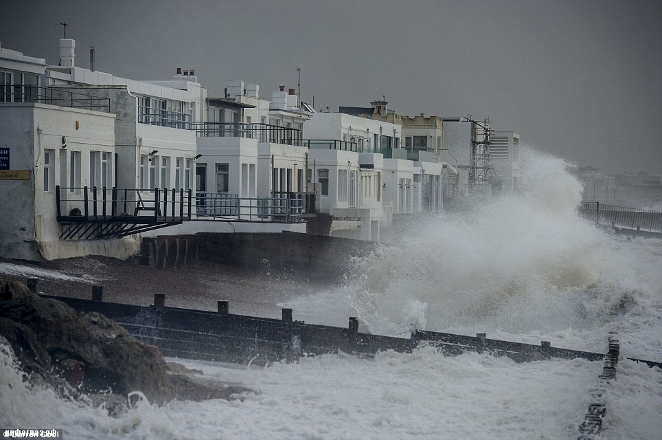 Splash: Gale force winds, rain and tidal surges battered the UK coastlines yesterday. This is the scene on Western Esplanade in Brighton, East Sussex